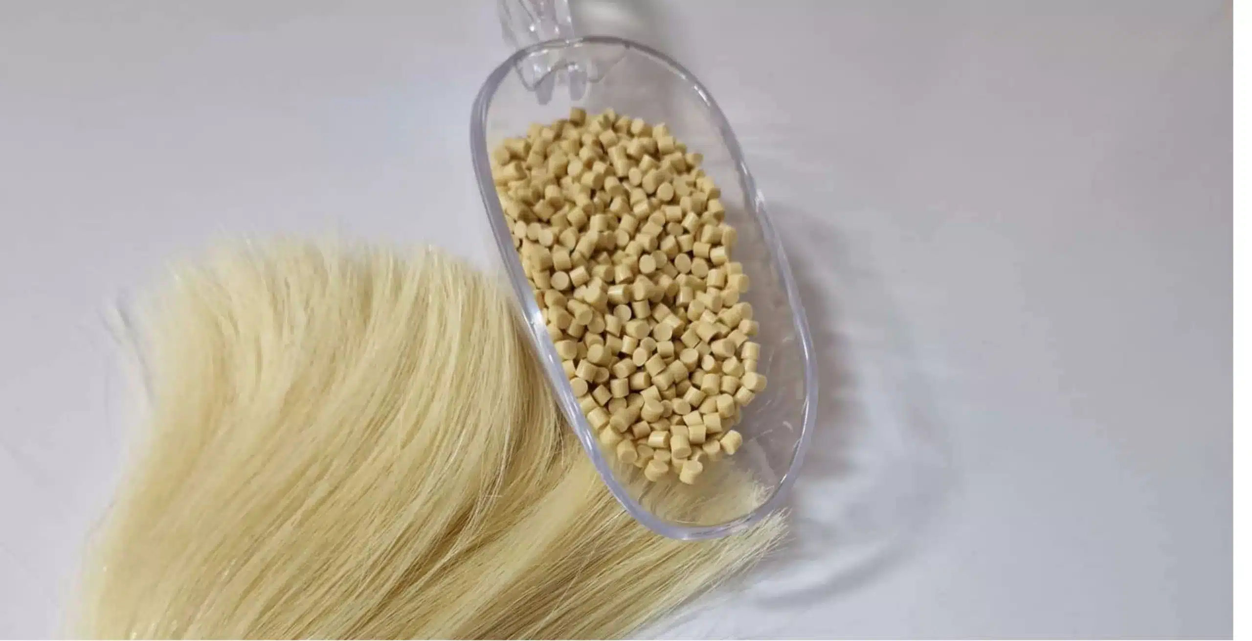 Keratin bond material used for hair extension attachments