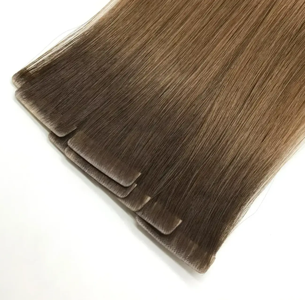 Close-up of Invisible Tape-In Hair Extensions showing the seamless root
