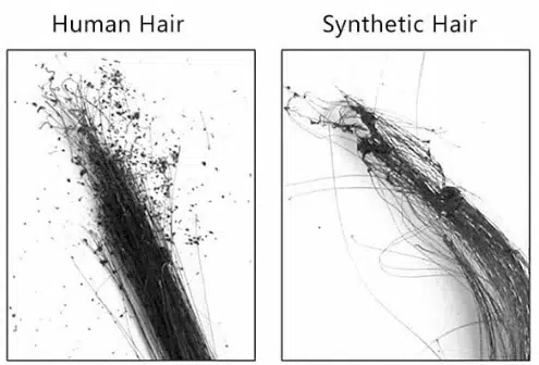 Hair extension burn test A hand holding a strand of hair over a flame for a burn test