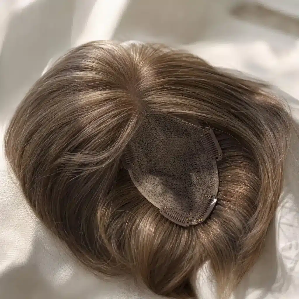 woman with thinning crown hair during a salon consultation for a hair topper