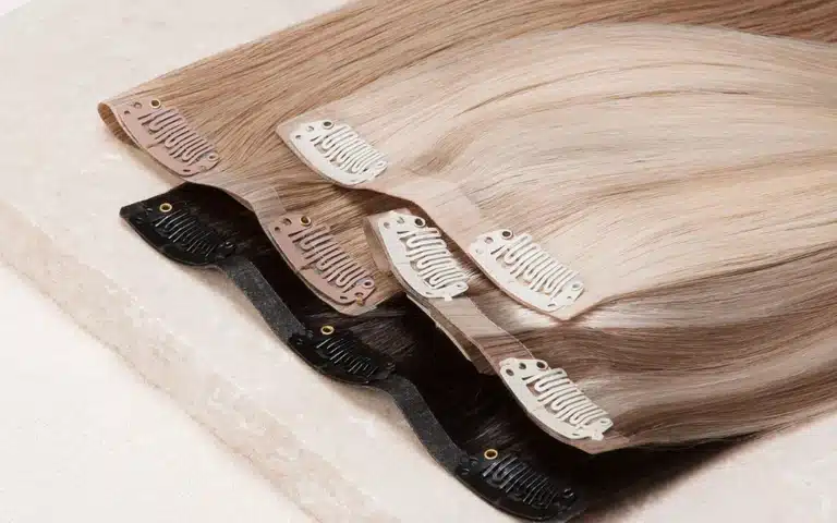Close-up of a clip in hair extension weft with secure clips