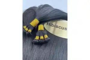 Silver-gray human hair extension bundles arranged for salon color planning.
