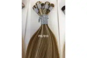 Hand tied weft extensions arranged for salon row and volume planning.