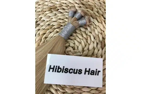 Human hair weft bundles compared before a low profile weft order