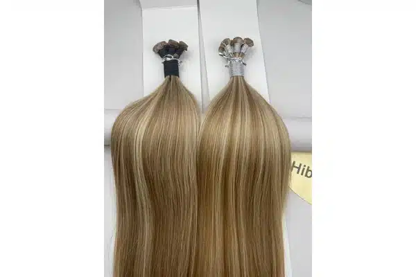 Tape-in extensions shown for branded pack and shade planning