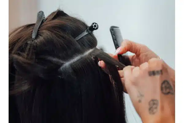 Tape in hair extensions shown for controlled placement planning