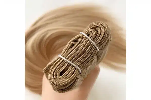 Double weft seam and hair ends inspected during a salon sample test