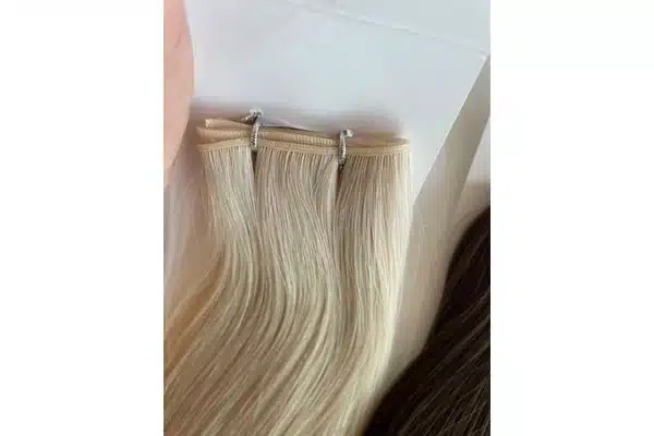 Low profile hair weft seam shown for concealment checks