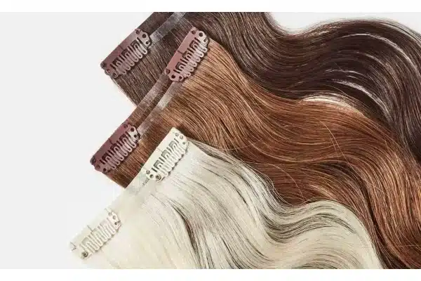 Wavy clip in hair extensions compared under neutral light for color matching