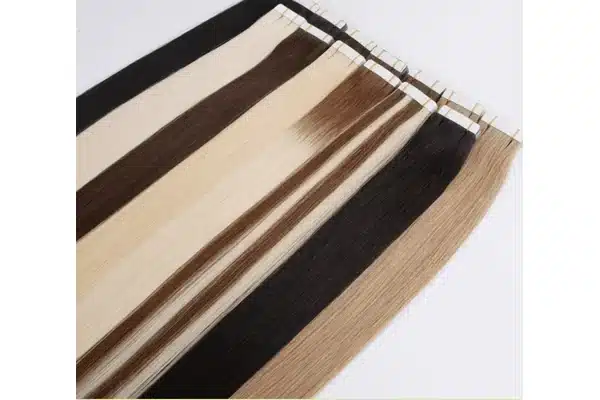 Brown, blonde, and blended tape in extension panels arranged side by side.
