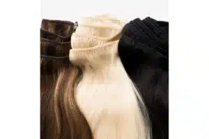 Black, blonde, and brown clip-in hair sets are displayed side by side.