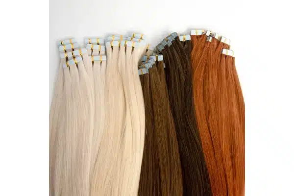 Tape-in extension lengths laid out together to compare their visible ends.